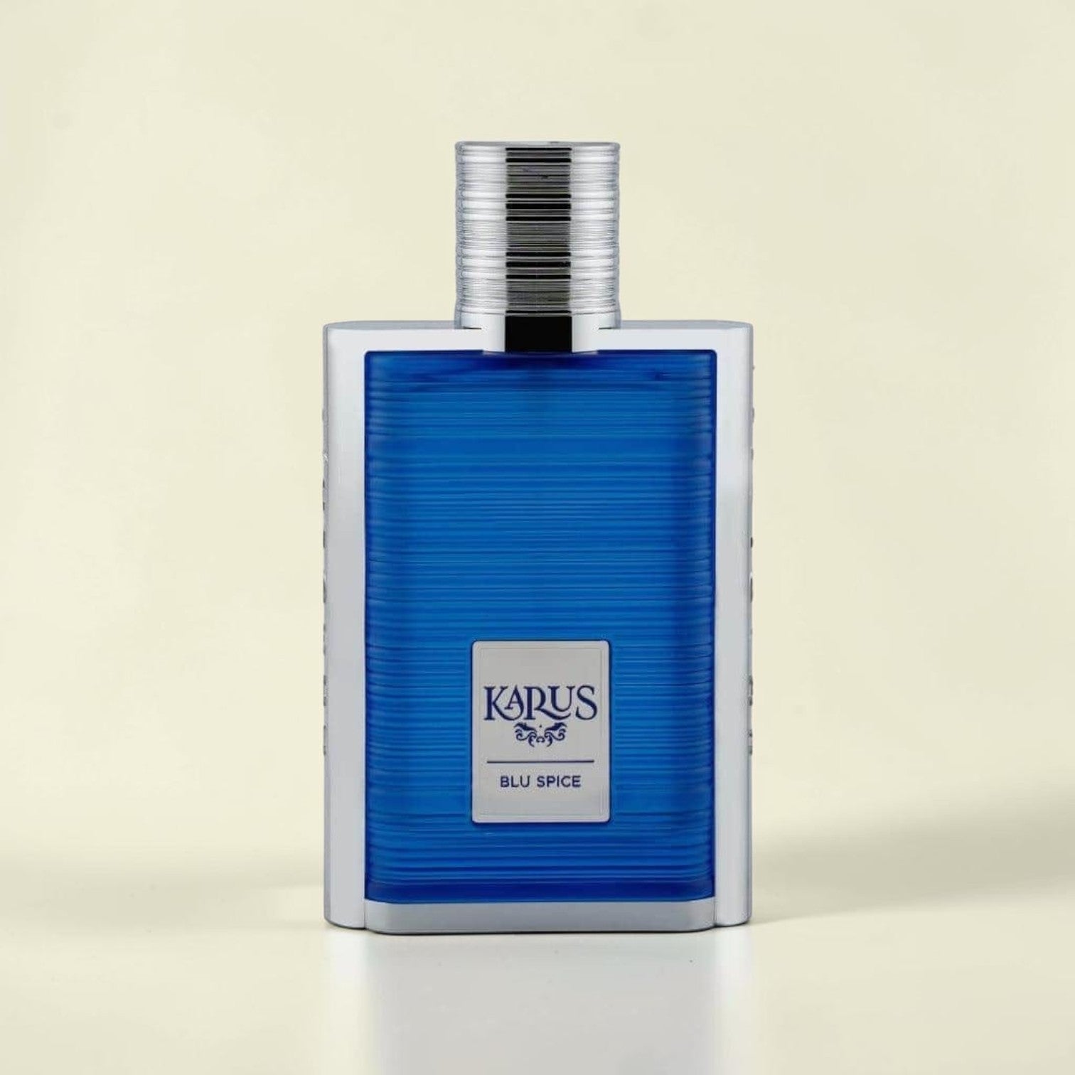 Oud Sera Khadlaj Karus Blu Spice perfume in a sleek rectangular blue glass bottle with silver accents.