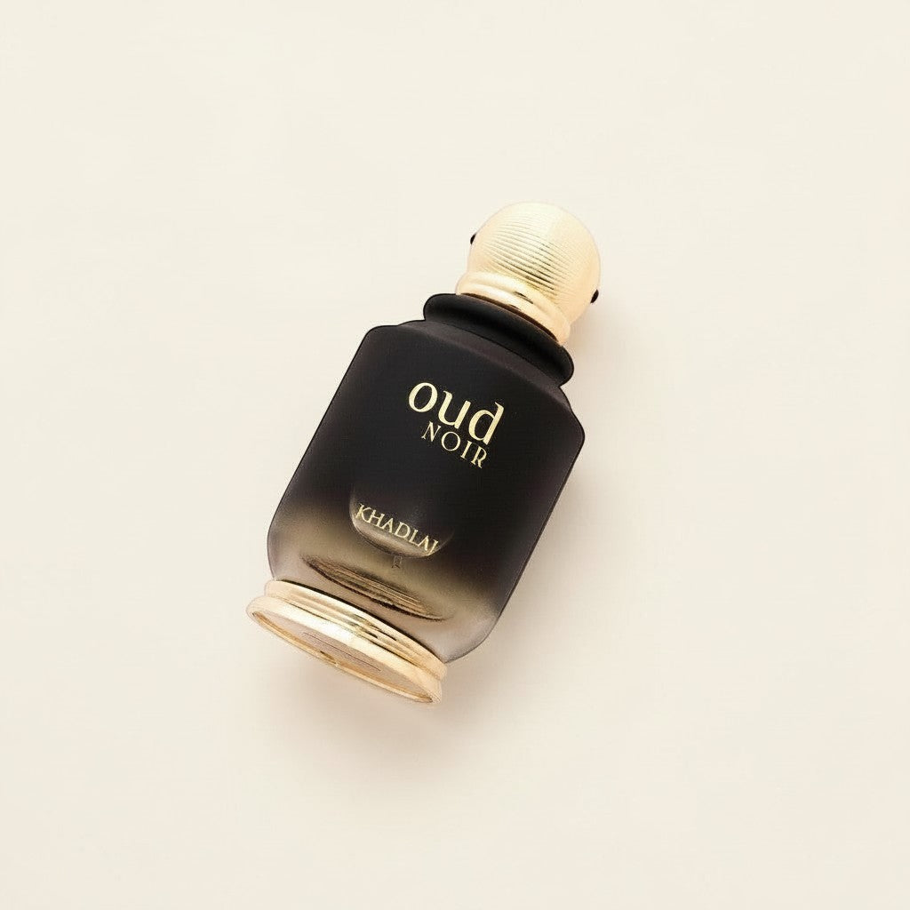 Oud Sera Khadlaj Oud Noir Eau de Parfum in a black gradient glass bottle with gold accents on a neutral background.