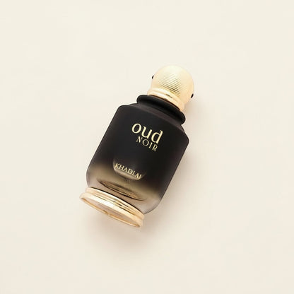 Oud Sera Khadlaj Oud Noir Eau de Parfum in a black gradient glass bottle with gold accents on a neutral background.