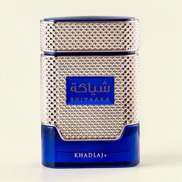 Oud Sera Khadlaj Shiyaaka Blue perfume bottle for men with a textured gold cap and deep blue glass base.