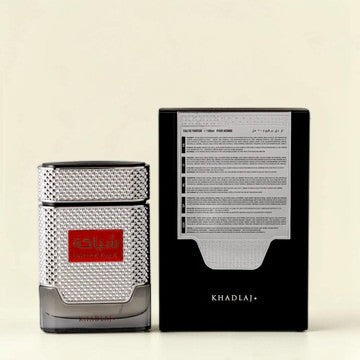 Oud Sera Khadlaj Shiyaaka Silver 100ml perfume bottle with textured metallic finish and its black presentation box