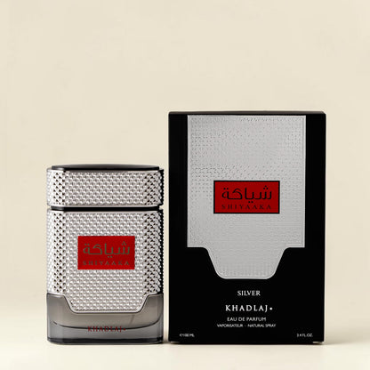 Oud Sera Khadlaj Shiyaaka Silver eau de parfum bottle and black box with textured metallic silver accents