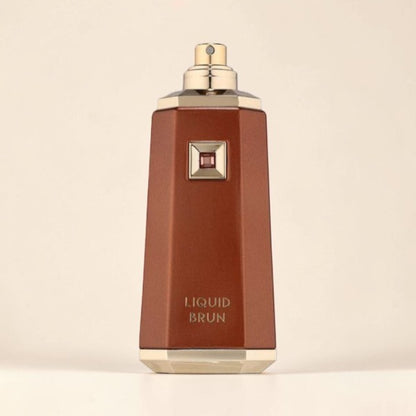 Oud Sera French Avenue Liquid Brun unisex eau de parfum in a sleek brown bottle with gold accents and a square emblem.